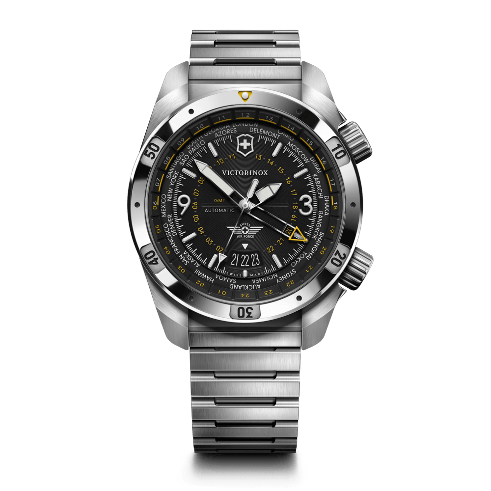 Victorinox World Time Automatic watch with a stainless steel bracelet, black dial, and yellow accents, shown on a white background.