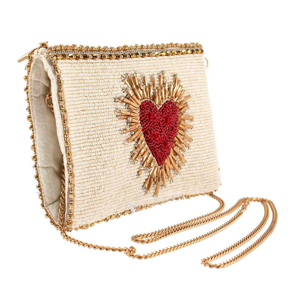 Beaded handbag with a red heart design on a white background