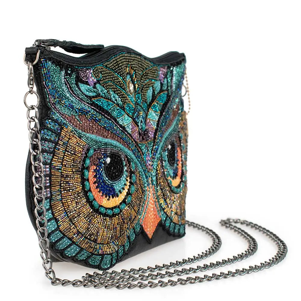 Beaded owl-themed handbag with chain strap on a white background