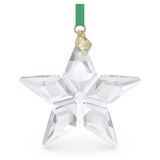 A clear crystal star-shaped ornament with a green ribbon and a gold-tone plated tag.