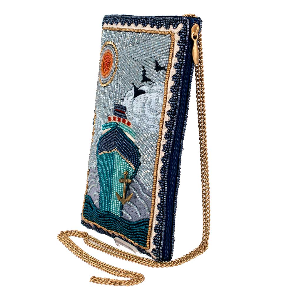 Embroidered handbag with ship design on a white background