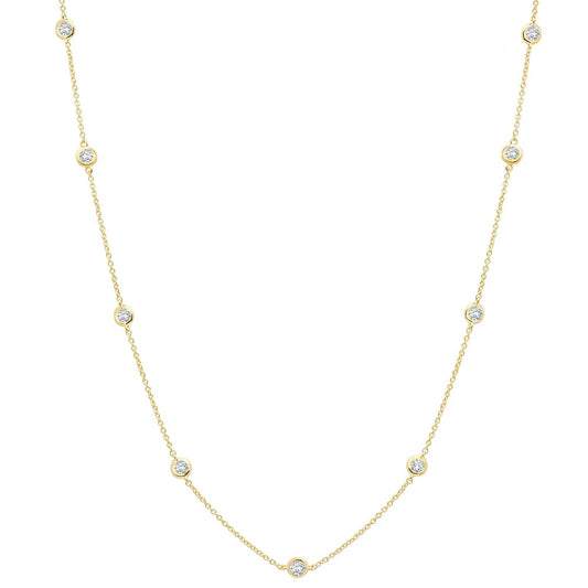 A 16-inch bezel set cubic zirconia necklace in gold, with adjustable length from 16 inches to 18 inches.