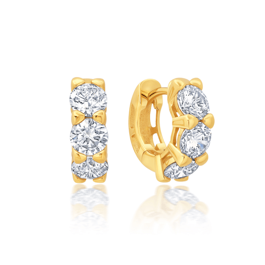 A pair of medium-sized huggie hoop earrings with cubic zirconia, set finished in 18kt yellow gold