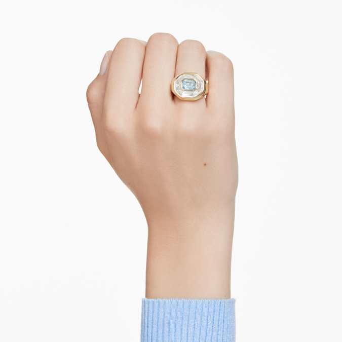 A gold-tone plated band ring on model