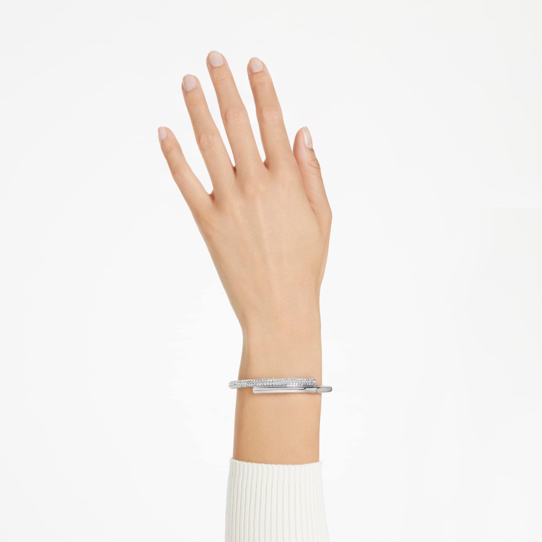 Silver tone bracelet with small stones on a wrist