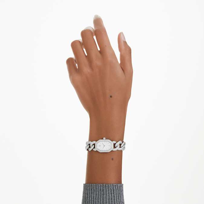 A silver tone Swarovski watch on wrist