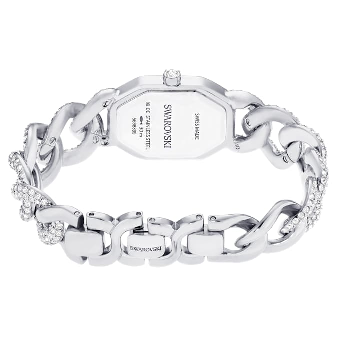 A silver tone Swarovski watch background
