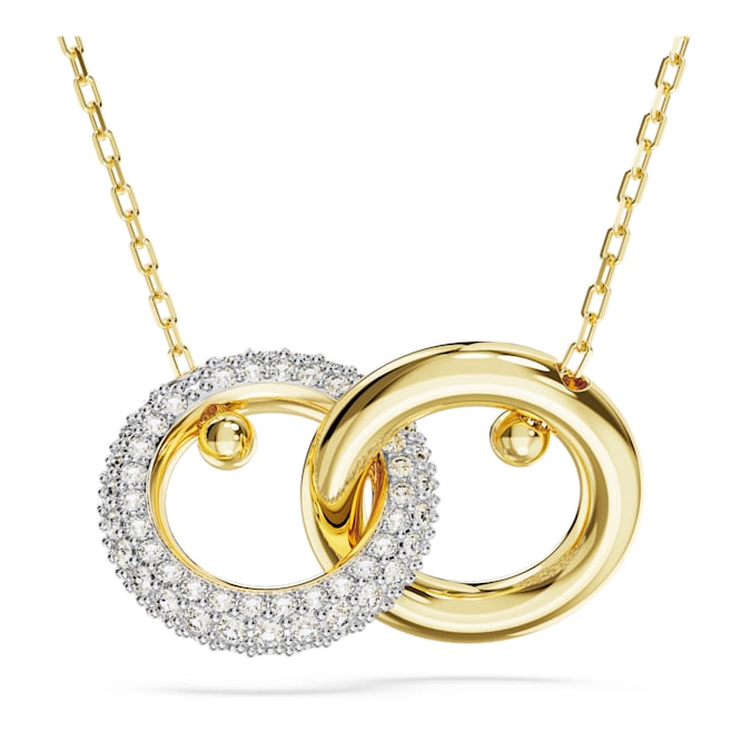 A gold-tone pendant with an interlocking loop design, featuring white (possibly Swarovski) crystals on the smaller circle.