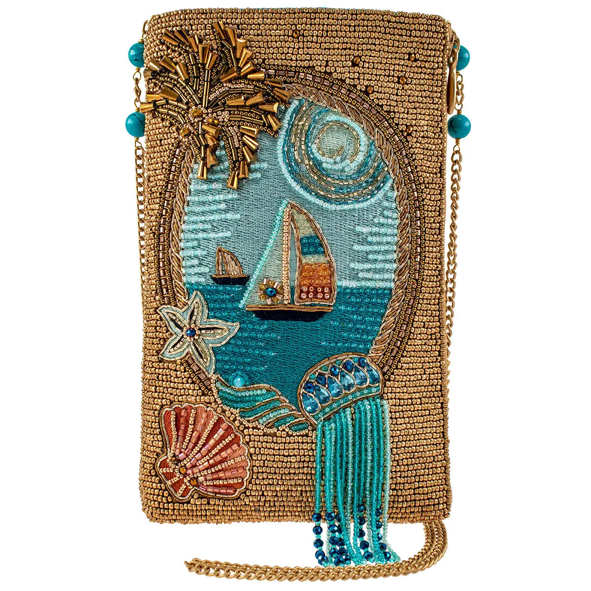 A beaded crossbody phone bag with a sail boat and ocean theme, featuring embellished sea shells and palm trees, with a tassel on the strap.