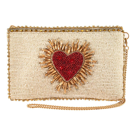 Beaded clutch with a red heart design on a white background