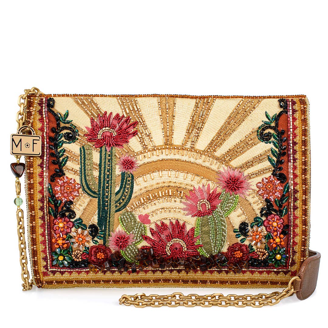 Embroidered clutch with cactus and floral design on a beige background