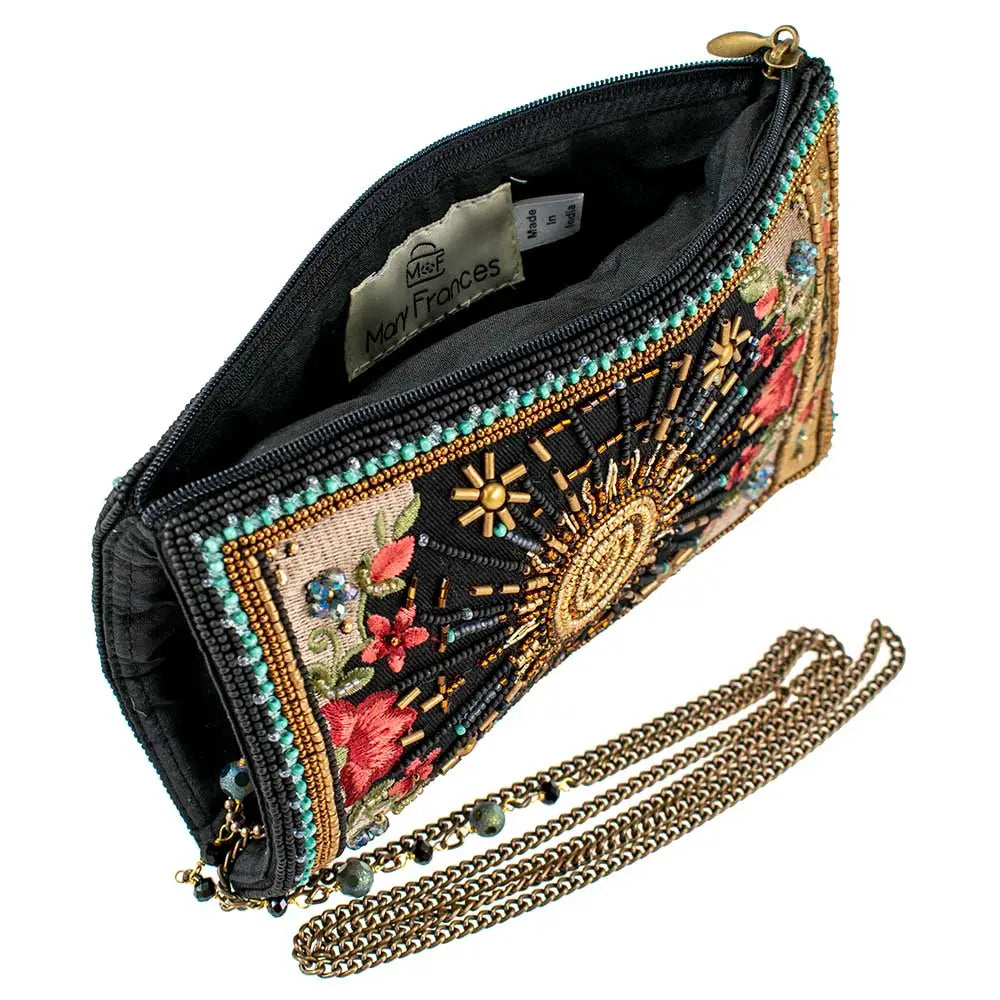 Embroidered handbag with floral patterns and a chain strap on a white background.