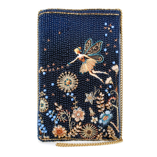 Decorative clutch with fairy and floral design on a dark blue background