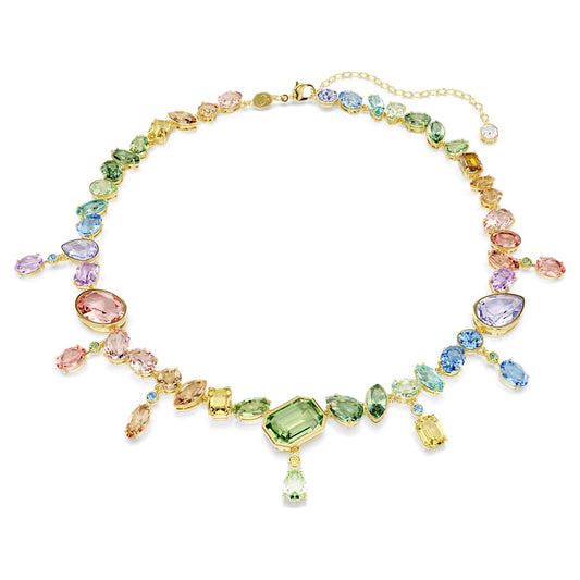 Swarovski Constella necklace with mixed-size blue and clear crystals on a rhodium-plated chain, shown flat on white.