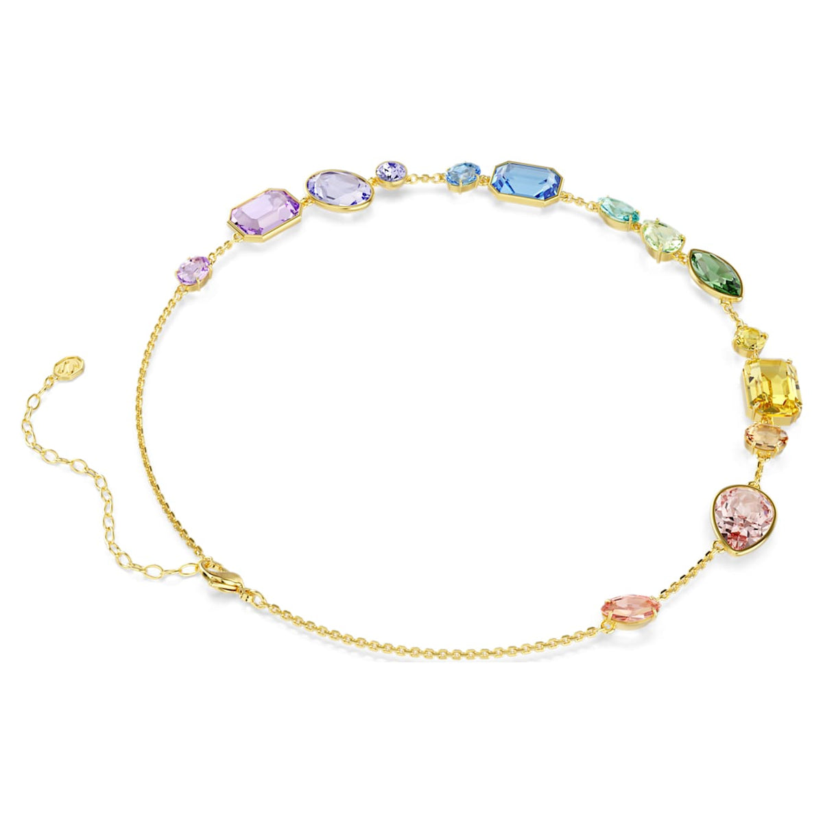 Side of a gold plated necklace with multicolored gemstones on a white background.