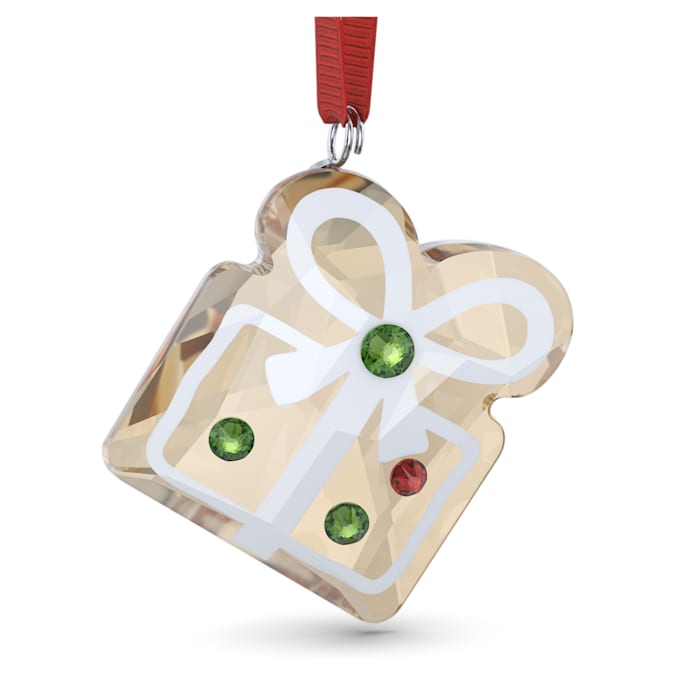 A gingerbread cookie-shaped gift ornament with golden effect crystals and red ribbon.