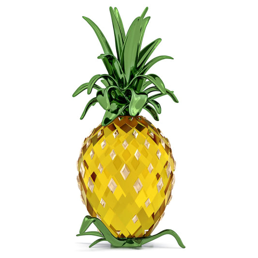 A crystal pineapple display with a glossy lacquered green metal leaf top, featuring a yellow textured body.