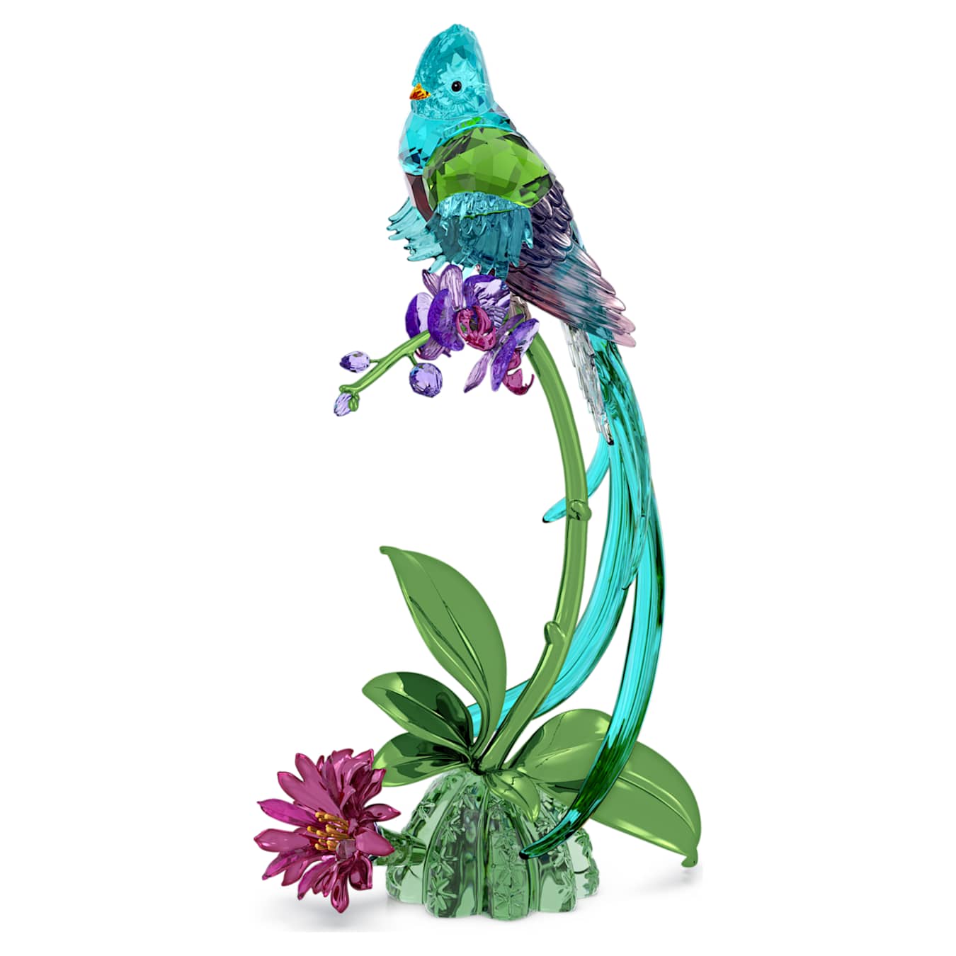Crystal figurine of a bird perched on a branch with flowers on a white background