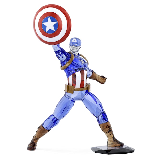 A figurine of Captain America, predominantly blue and red, with a shield held aloft.