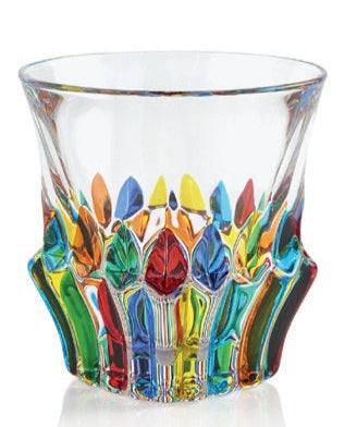 A multicolored, artistic whisky glass with a geometric pattern on the lower part.