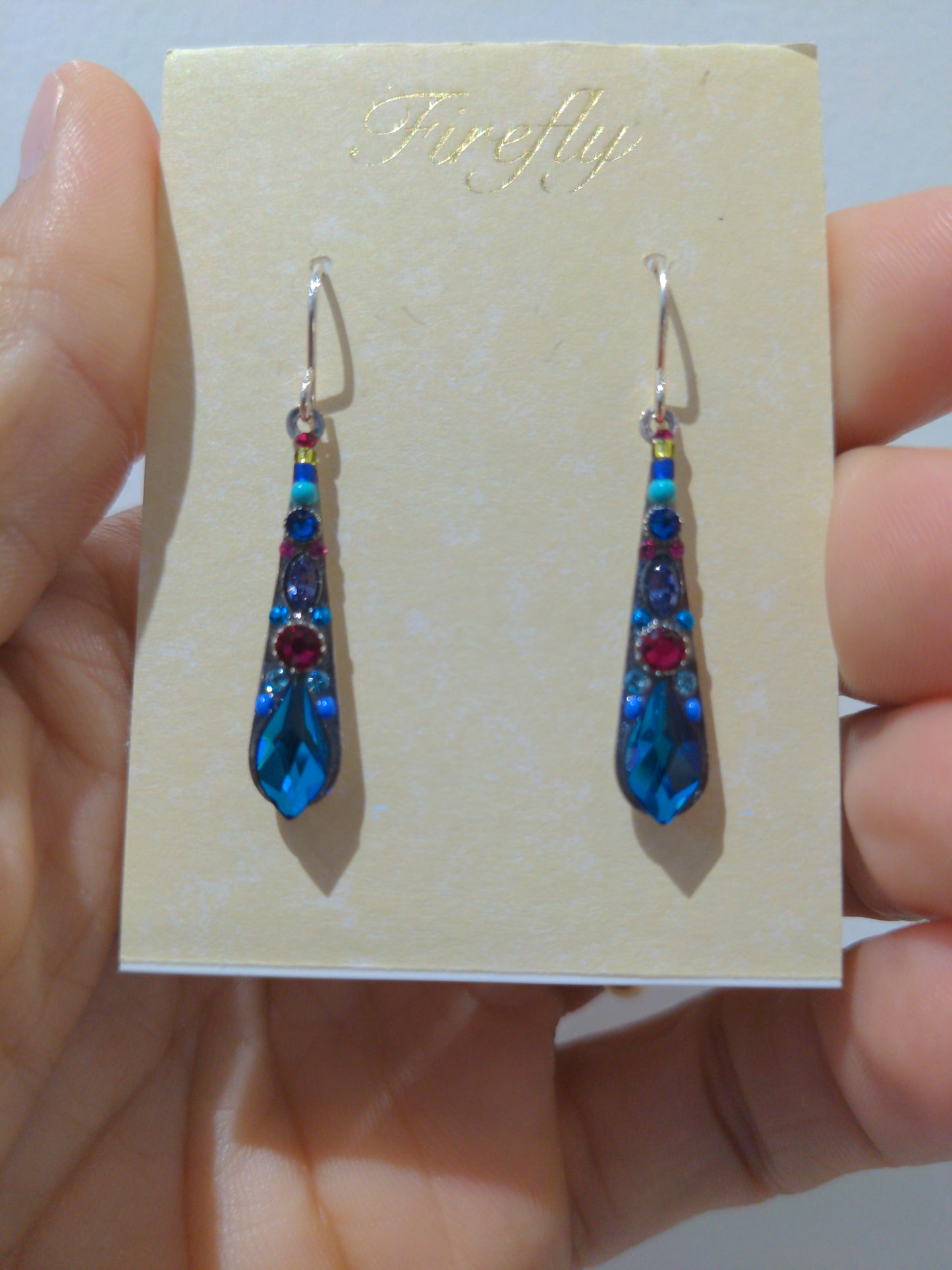 A pair of Bermuda blue earrings with new silver wire design.