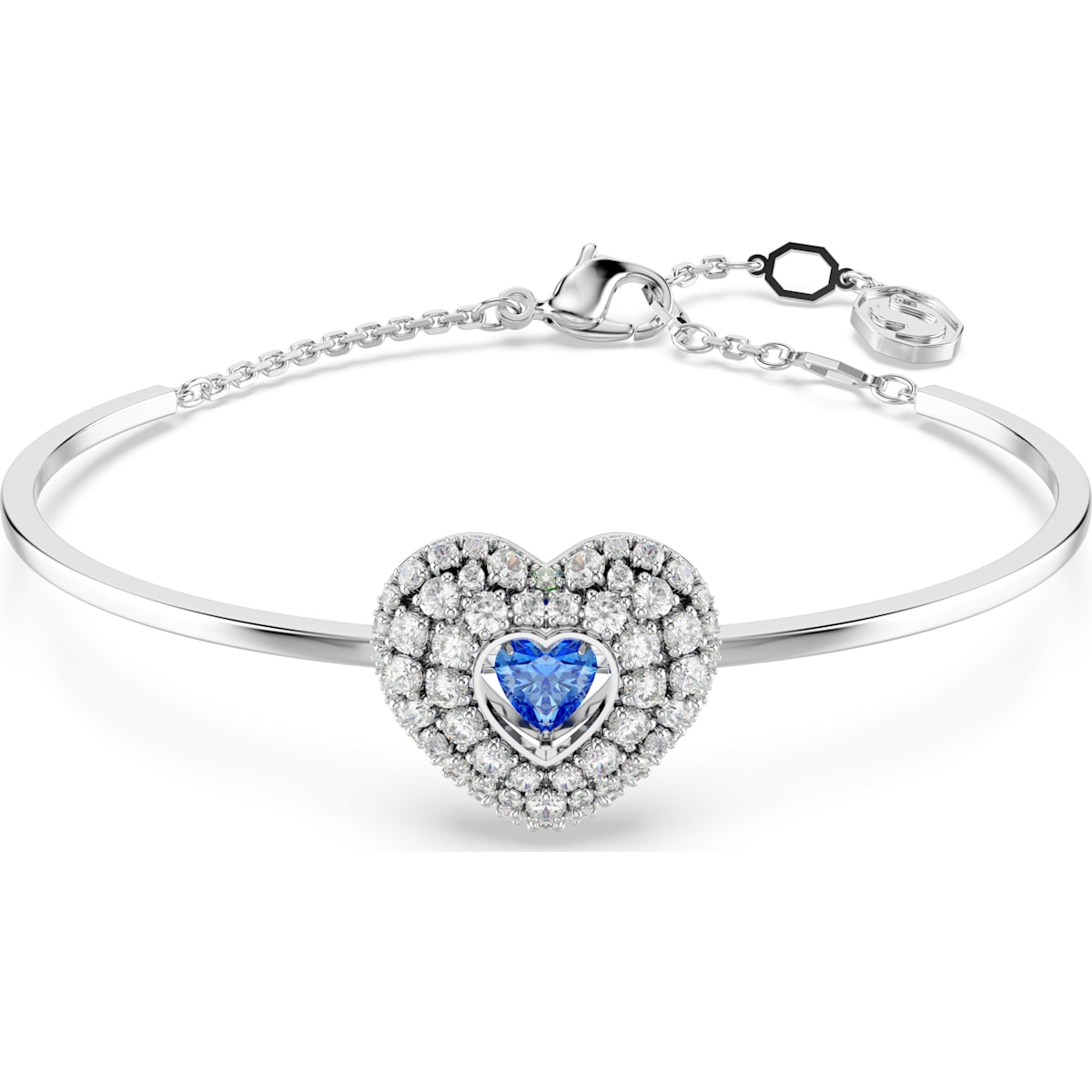 A rhodium-plated silver bangle featuring a heart-shaped design with a blue central stone and surrounded by smaller clear stones.