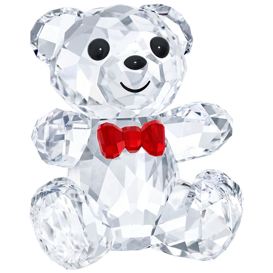 A clear crystal figurine of a smiling bear with a red bow tie and a base for stability.