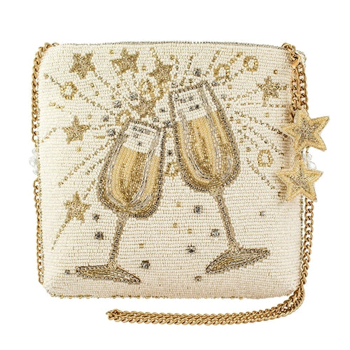 A crossbody handbag with a design featuring two champagne glasses adorned with beads and a removable chain strap.