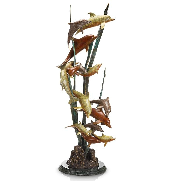A brass sculpture of a dozen dolphins in various poses on a marble base, finished with a hot patina technique.
