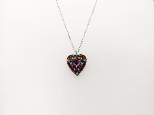 A multicolored heart-shaped Firefly Jewelry necklace with embellishments and a lobster claw clasp.