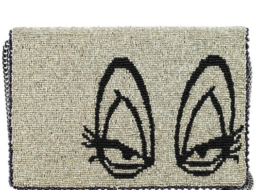 Mary Frances Crossbody Bag with a beige and black design featuring cat faces, a chain strap, and a fabric body.