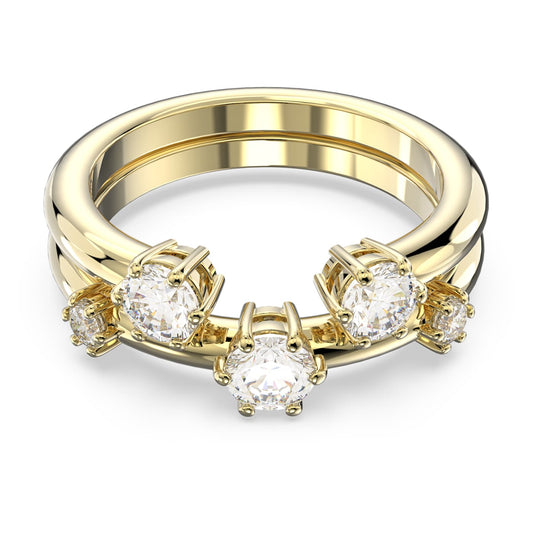 A gold-tone plated band ring with round cut white zirconia stones set in a gold-tone plated band.