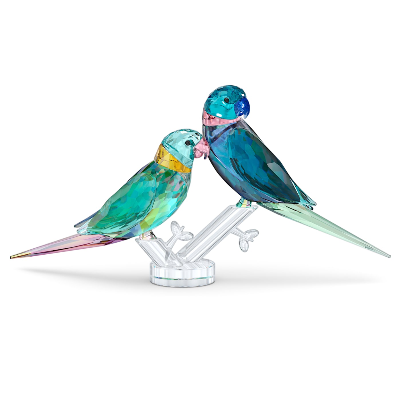 A crystal figurine of a pair of multicolored parakeets perched on a clear crystal branch.