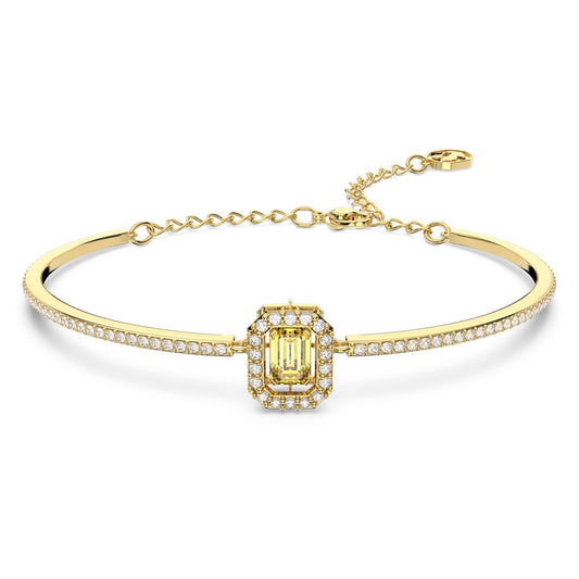 Yellow octagon-cut stone bangle with gold-tone plating on white back ground.
