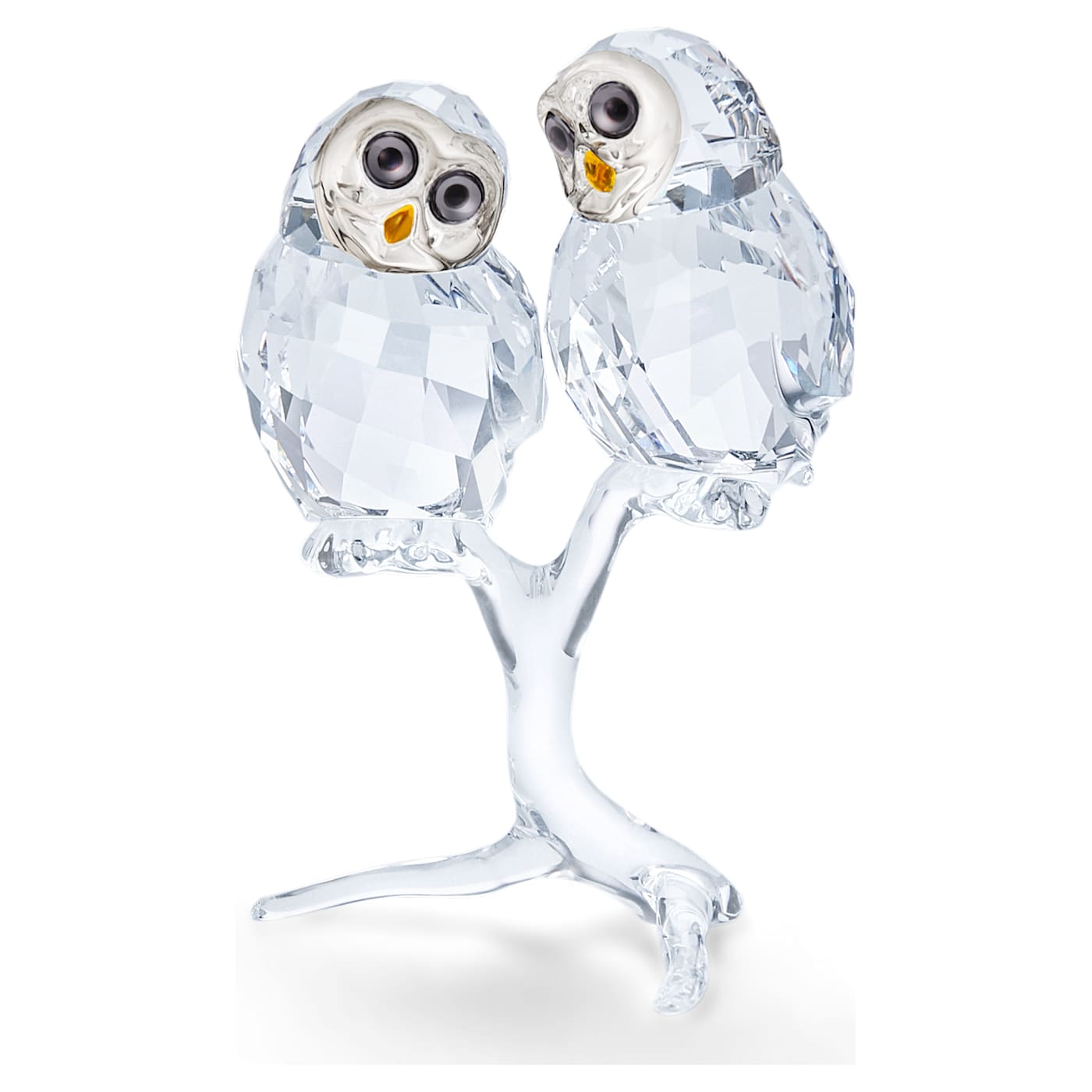 A crystal figurine of an owl couple with a loving expression, featuring clear crystal facets and perched on a small crystal tree.