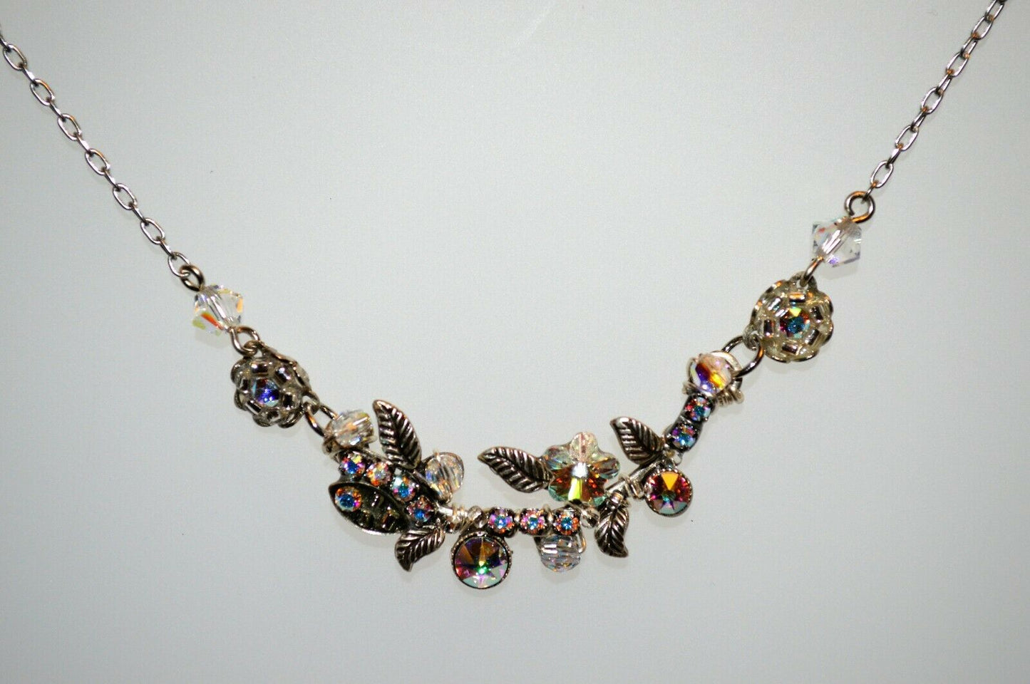  silver-colored Firefly brand aurora borealis necklace.