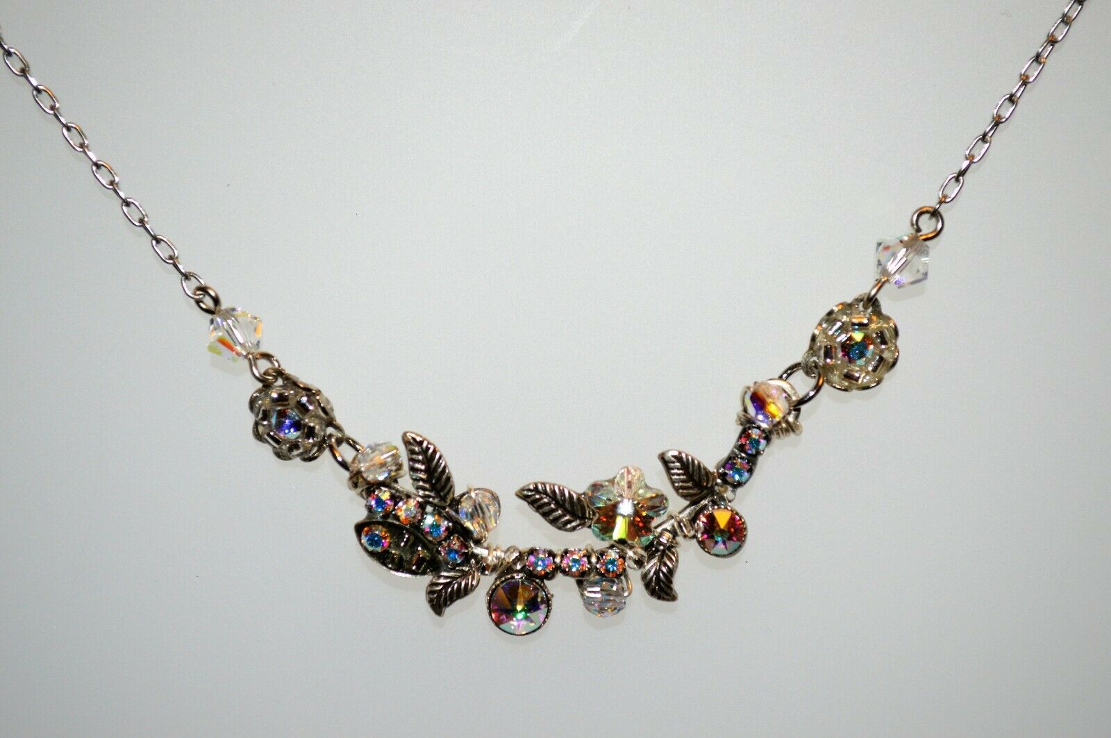  silver-colored Firefly brand aurora borealis necklace.