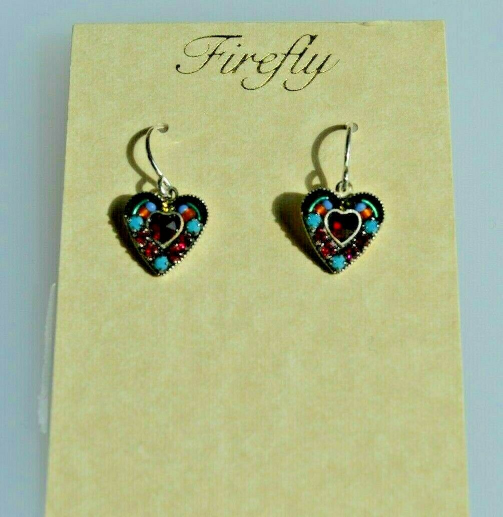 A pair of blue and multicolored Firefly Jewelry earrings, featuring heart shapes with silver wire backing, displayed against a beige background.