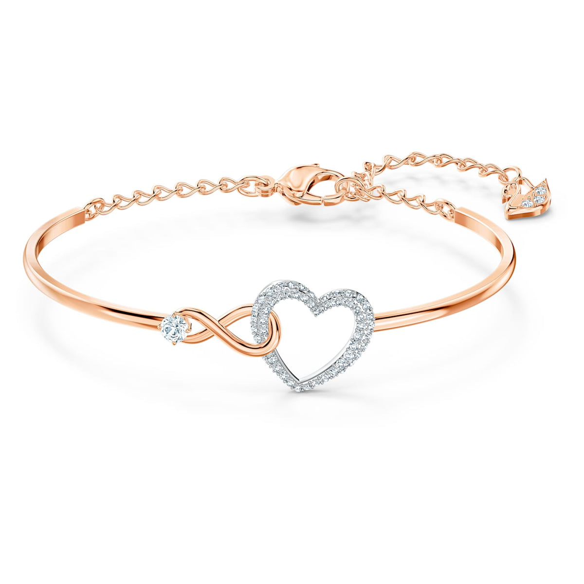 A Swarovski Infinity bangle bracelet featuring a white heart motif and infinity symbol, with a mixed metal finish.