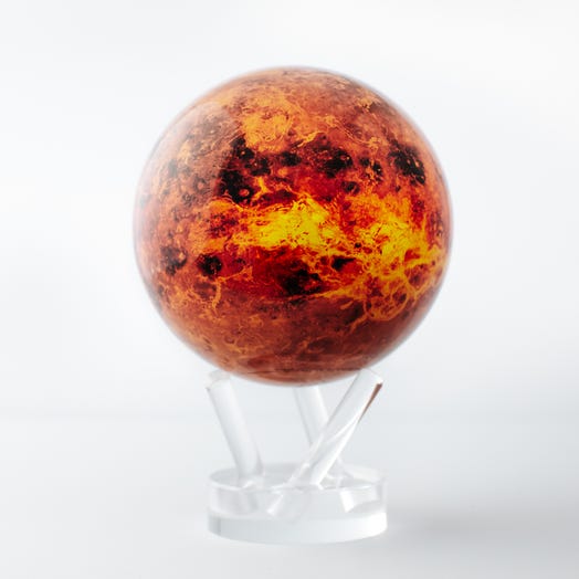 A 4.5 inch diameter globe representing the planet Venus with a bold red and orange color scheme, placed on a clear stand.